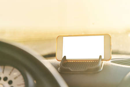 The map on the phone in the background of the dashboard.の写真素材