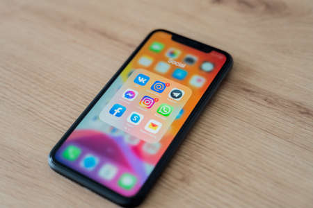 Kaliningrad, Russia - March 09, 2021: Icons of various social networking applications on the mobile phone screen.のeditorial素材