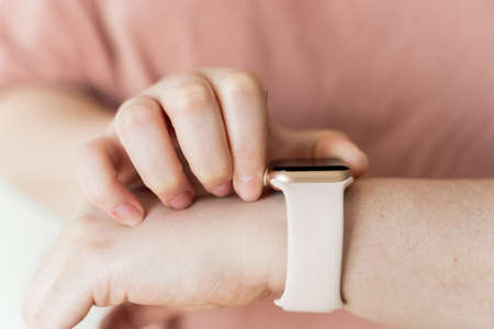Kaliningrad, Russia - March 9, 2021: Apple watch on hand at a young woman.