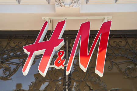Novi Sad, Serbia - 06.05.2021: Closeup of H and M sign on modern building facade in the street