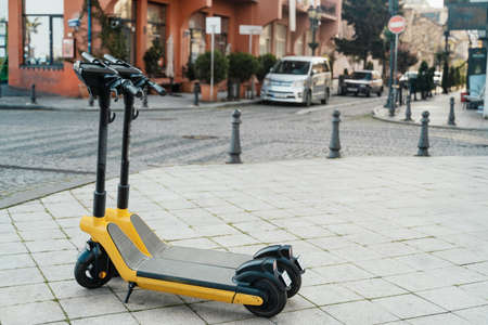 Electric scooters for rental . Vehicle rent service background. Electric kick scooters for transportationの写真素材
