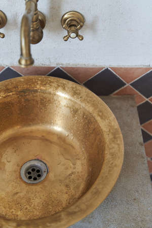 Gold sink and faucet in vintage styleの写真素材