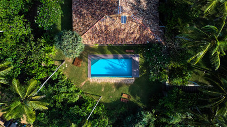 Aerial view of a villa with a swimming pool in the tropics. Hiriketiya beach, Sri Lanka