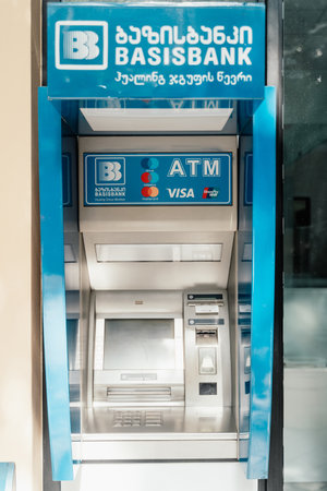 Batumi, Georgia - 04.07.2021: Blue ATM of Basisbank on the street in Batumi, Georgiaのeditorial素材