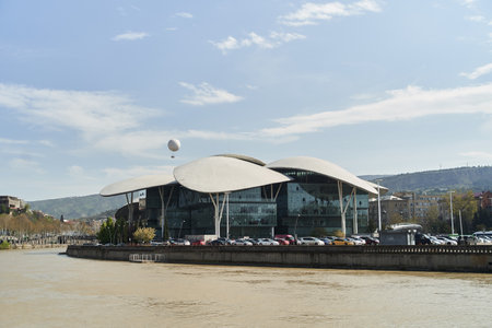 Tbilisi, Georgia - 15.04.2021: Georgia Public Service Hall building across the Kura River.のeditorial素材