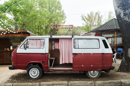 Tbilisi, Georgia - April 28, 2021: Photo booth in red retro Volkswagen minibus
