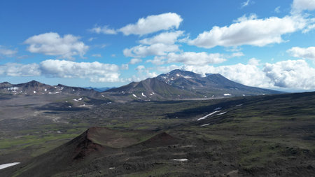 A breathtaking and stunning mountain vista surrounded by a lush and vibrant green landscape
