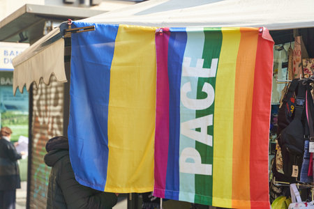 The flag of Ukraine and the LGBT flag are sold in a street tent.の写真素材