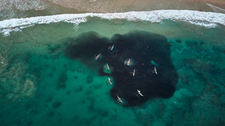 Aerial view of boats of fishermen fishing in the oceanの写真素材
