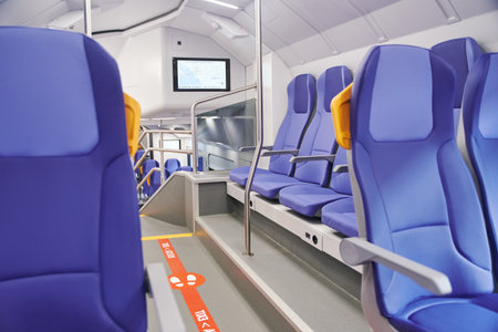 Modern high speed train interior with empty blue seatsの写真素材