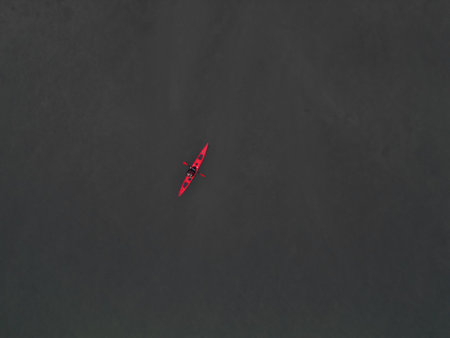 Experience the serene and calming adventure of kayaking on beautiful, tranquil watersの写真素材