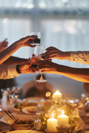 Clink glasses at a wedding celebration after saying congratulations.の写真素材