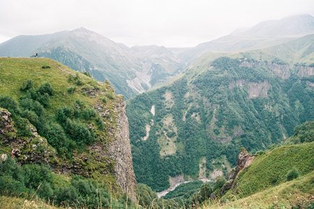 View of the green mountain peaks in Georgia. Grainy film in the style of old photosの写真素材