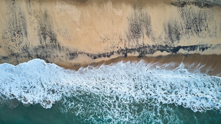 Aerial view of an emerald green sea and big foaming waves. Indian Ocean. Dikwella beach. Sri Lankaの写真素材