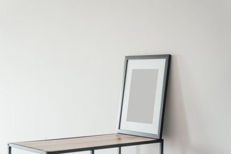 Blank wooden photo frame stands in the interior on a white background. Mockupの写真素材