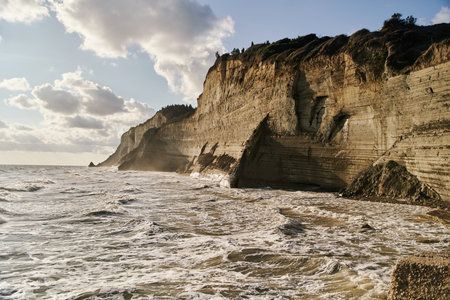 View of Logas Beach and the amazing rocky cliff in Peroulades. Corfu island. Greeceの写真素材