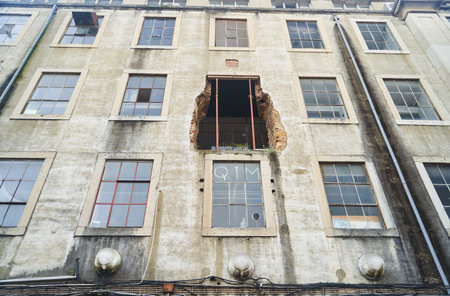 Lisbon, Portugal - 29.12.2022: An Abandoned Building that features a Damaged and Worn Facade, showcasing its dilapidated stateのeditorial素材