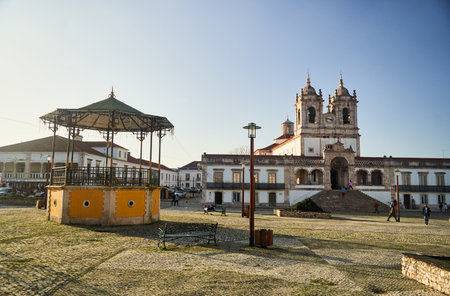 Nazare, Portugal - 27.12.2022: The central square of Nazare with pavilion and Nossa Senhora da Nazare Church on the background. Portugalのeditorial素材