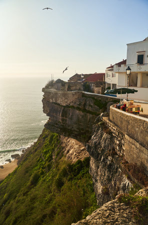 Nazare, Portugal - 27.12.2022: Beautiful Coastal Homes Strategically Positioned for Spectacular Views of the Ocean at Sunsetのeditorial素材