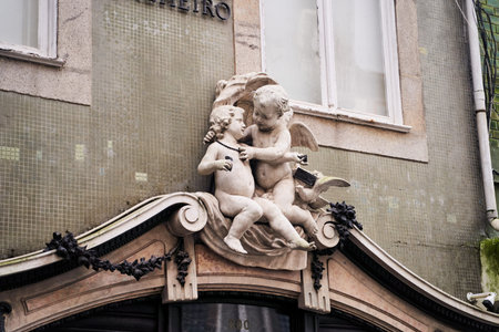Porto, Portugal - 12.25.2022: Discover the Elegant Architectural Detail Featuring Cherubs on a Magnificent Historic Buildingのeditorial素材
