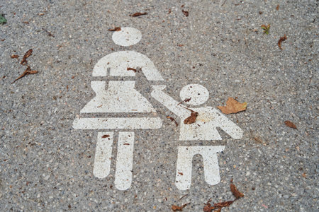 Parent and Child Sidewalk Sign, safety and guidance. Keywords autumn, care, familyの写真素材