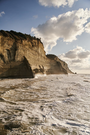 View of Logas Beach and the amazing rocky cliff in Peroulades. Corfu island. Greeceの写真素材