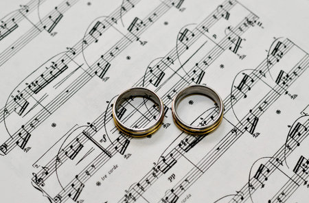 Two wedding rings on the music - wedding ceremonyの写真素材