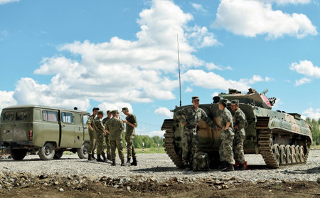The parade ground with a tank and a car in the International army games in Novosibirsk, Russia