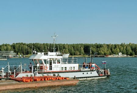 Boat on the dock in the Bay on a Sunny summer dayの写真素材
