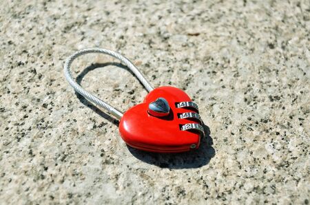 Red wedding lock in the form of heart with digital codeの写真素材