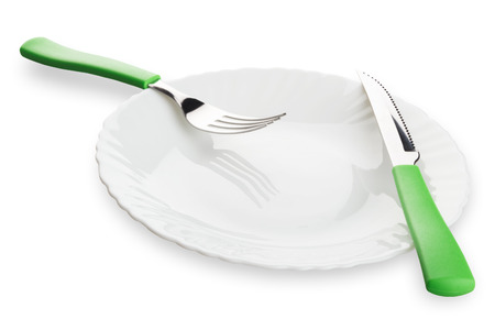 Dinner plate, knife and fork isolated. Clipping path includedの写真素材