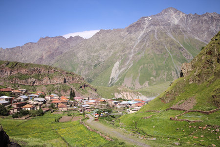 stepantsminda on the background of Kuro range