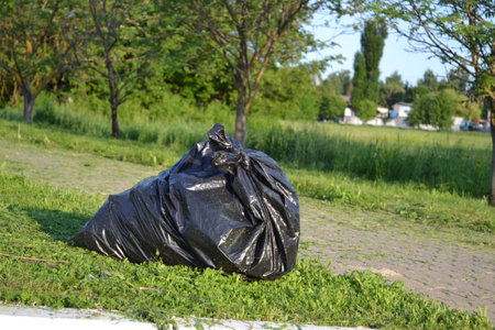Garbage bags in nature. Garbage on the road.の写真素材