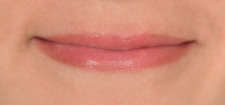 Small smile on girls faceの写真素材
