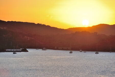 orange sunset on caribbean islandの写真素材