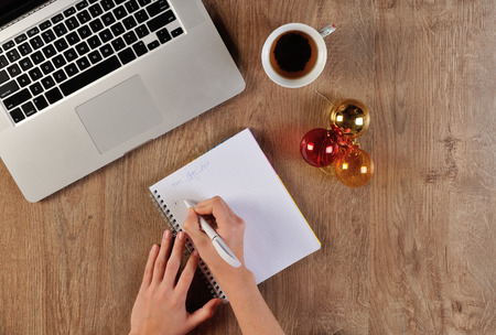 Person starting wishing list for cristmasの写真素材