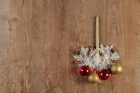 christmas balls and candle on wood floorの写真素材