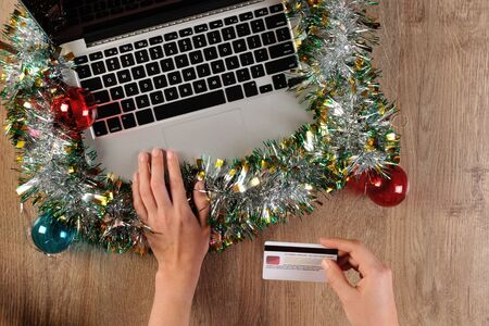 Person is ordering online via credit cardの写真素材