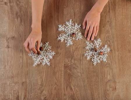 decorater making christmas toys on wood floorの写真素材