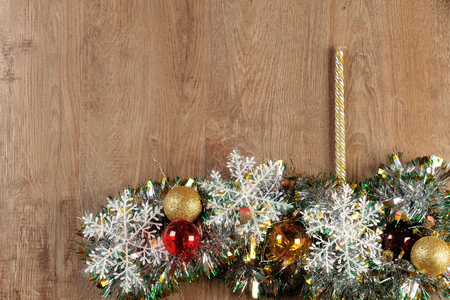 christmas balls and candle on wood floorの写真素材