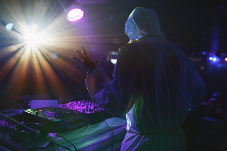 Dj is palying music in night clubの写真素材