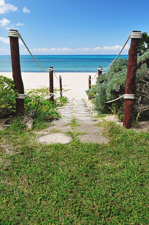 exit on blue beach with white sandの写真素材