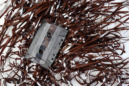 Audio casette on top of tape on a white backgroundの写真素材