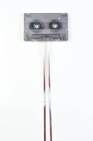 Audio casette with tape on a white backgroundの写真素材