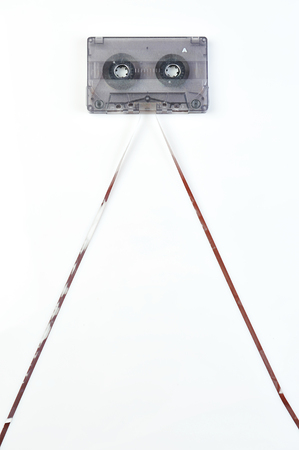 Audio casette with tape on a white backgroundの写真素材