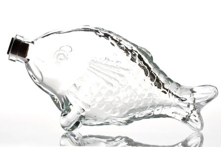 Empty fish shape bottle on a white backgroundの写真素材