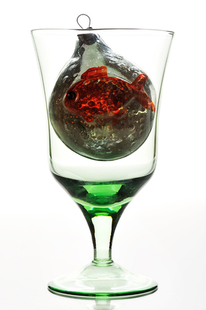 glass with christnmas toy on a white backgroundの写真素材