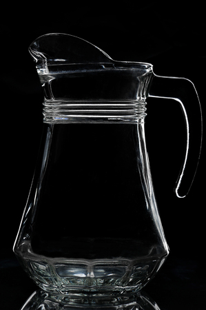 silhouette of empty jug on a black backgroundの写真素材