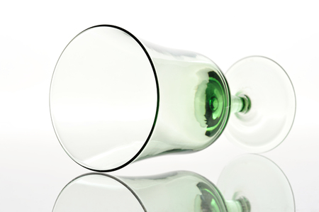 Empty glass laying down on a white backgroundの写真素材