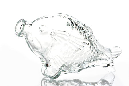 Empty fish shape bottle on white backgroundの写真素材